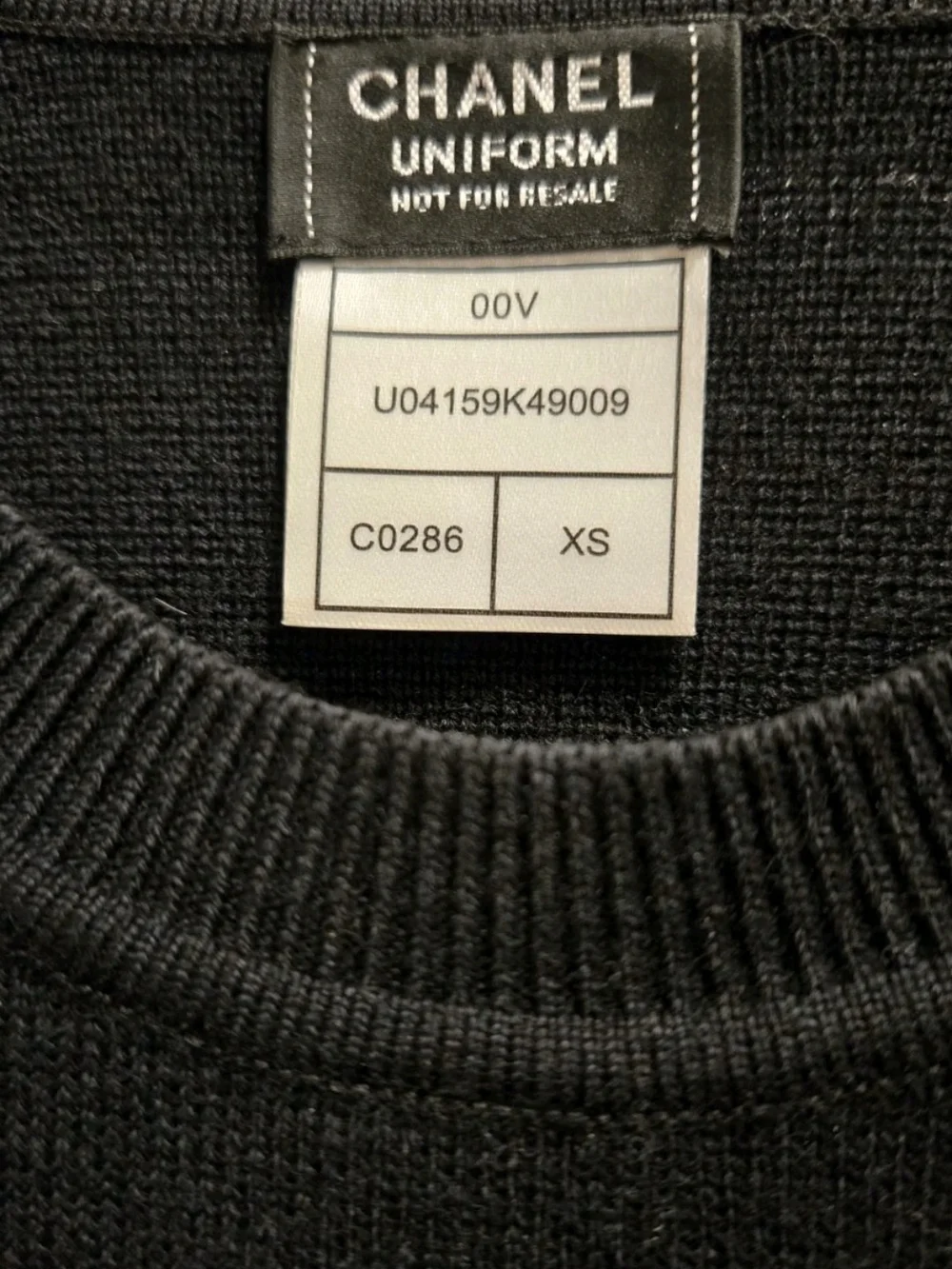 CHANEL Uniform Black Crewneck Sweater with Gold CC Sunburst